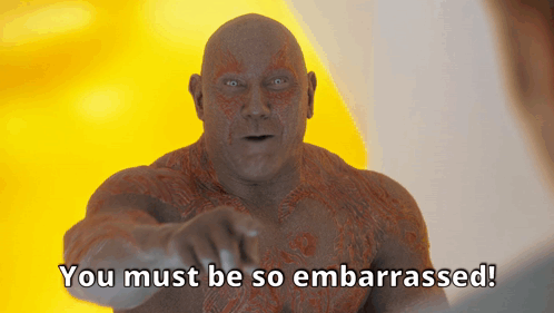 A Bald Man Is Pointing At The Camera With The Words You Must Be So Embarrassed Below Him GIF