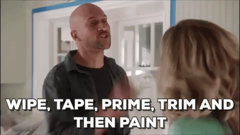 a bald man is talking to a woman in a kitchen and saying `` wipe , tape , prime , trim and then paint ''