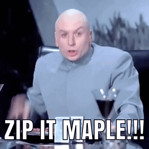 A Bald Man Sitting At A Desk With The Words Zip It Maple Written Below Him GIF