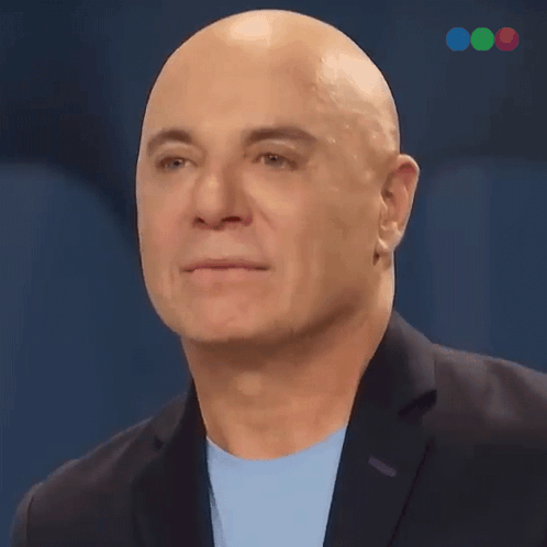 Bald Man In Suit And Light Blue Shirt GIF