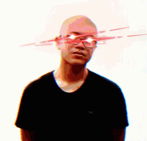 A Bald Man Wearing Glasses And A Black Shirt With A Hollister Logo GIF