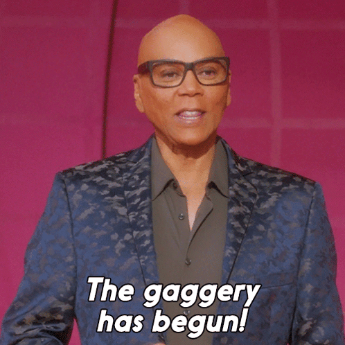 A Bald Man Wearing Glasses And A Blue Jacket Says The Gaggery Has Begun GIF