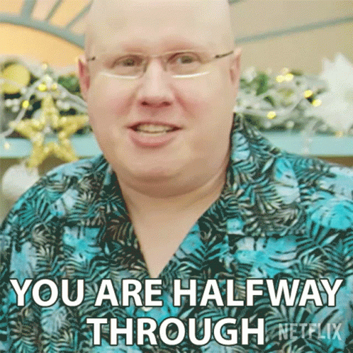 A Bald Man Wearing Glasses And A Blue Shirt Is Saying You Are Halfway Through Netflix GIF
