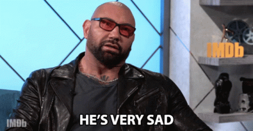 A Bald Man Wearing Glasses And A Leather Jacket Is Saying He 'S Very Sad GIF