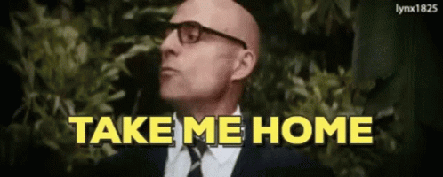 A Bald Man Wearing Glasses And A Suit Says Take Me Home GIF