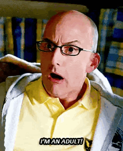 A Bald Man Wearing Glasses And A Yellow Shirt Is Saying `` I 'M An Adult ! '' GIF