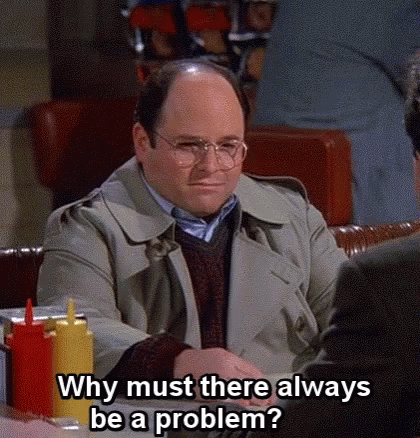 Bald Man With Glasses Sitting At Table Talking GIF