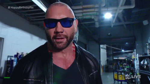 A Bald Man Wearing Sunglasses And A Leather Jacket With The Words Happy Birthday Ric On The Bottom GIF