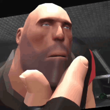 A Bald Man With A Beard And Blue Eyes Is Holding His Hand To His Chin GIF