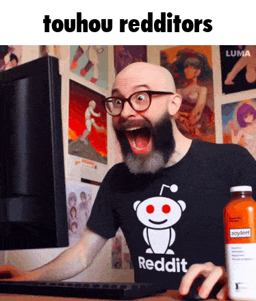 A Bald Man With A Beard And Glasses Is Using A Computer While Wearing A Reddit Shirt GIF