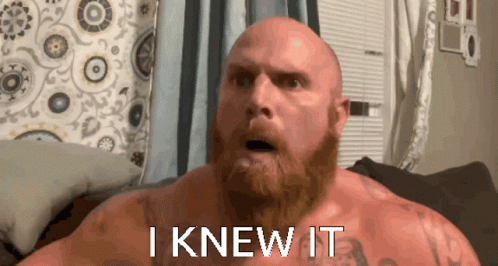 A Bald Man With A Beard Has The Words I Knew It Written On His Chest GIF