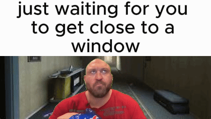 a bald man with a beard is holding a bottle of pepsi in front of a window .