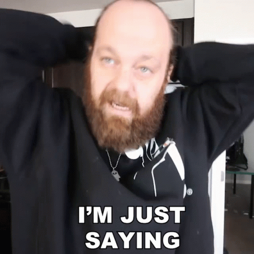 A Bald Man With A Beard Is Holding His Hands Behind His Head And Says I 'M Just Saying GIF