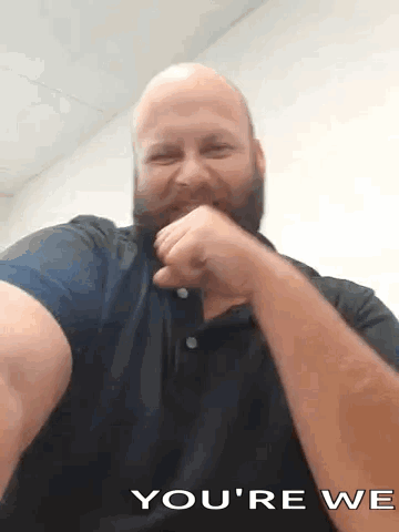 A Bald Man With A Beard Is Making A Funny Face And Says You 'Re We GIF