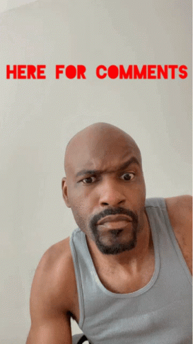 A Bald Man With A Beard Is Making A Funny Face In Front Of A Sign That Says " Here For Comments " GIF