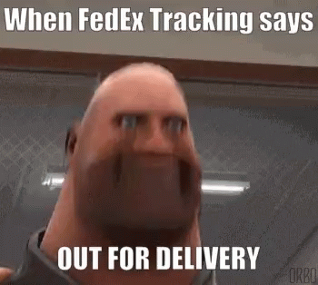 A Bald Man With A Beard Is Making A Funny Face While Standing In A Room . GIF