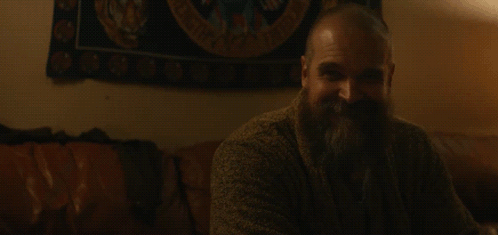 Bearded Man Sitting On Couch With So Filled Words GIF