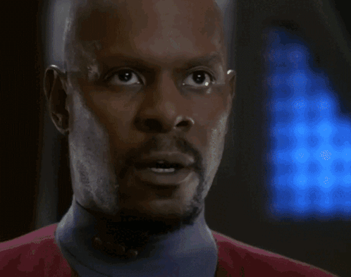 a bald man with a beard says right now i 've got 5,000 photon torpedoes armed and ready to launch