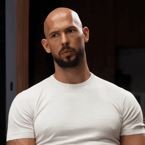 A Bald Man With A Beard Wearing A White T-Shirt GIF