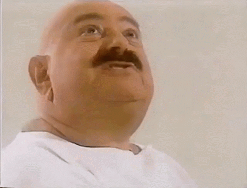 A Bald Man With A Mustache Is Eating A Sandwich From Subway GIF