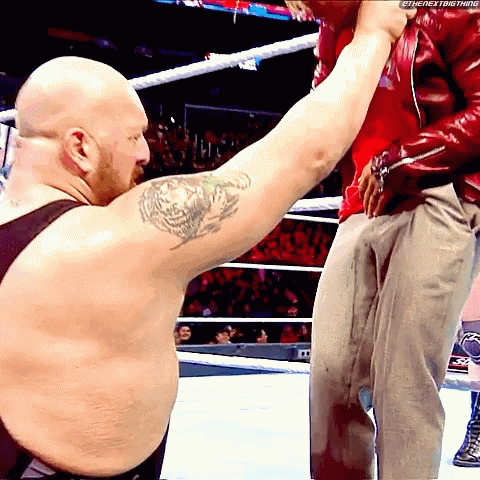 A Bald Man With A Tattoo On His Arm Holds Another Man 'S Arm GIF
