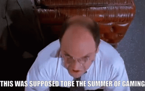 A Bald Man With Glasses Is Sitting In Front Of A Leather Couch And Says This Was Supposed To Be The Summer Of Gaming GIF