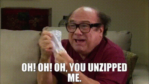 A Bald Man With Glasses Is Sitting On A Couch Holding A Piece Of Paper And Saying Oh Oh Oh You Unzipped Me GIF