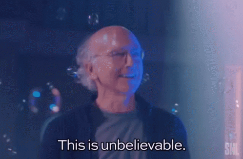 A Bald Man With Glasses Is Surrounded By Soap Bubbles And Says This Is Unbelievable . GIF