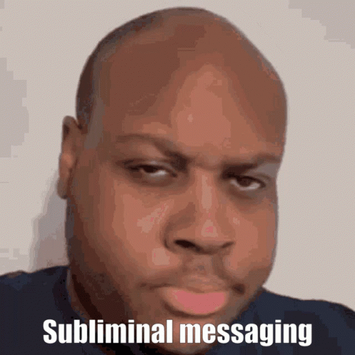 A Bald Man With The Words Subliminal Messaging Above His Head GIF