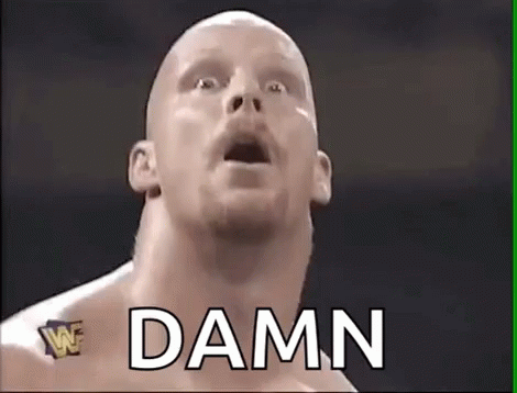 A Bald Wrestler With His Mouth Open And The Word Damn Written Above Him . GIF