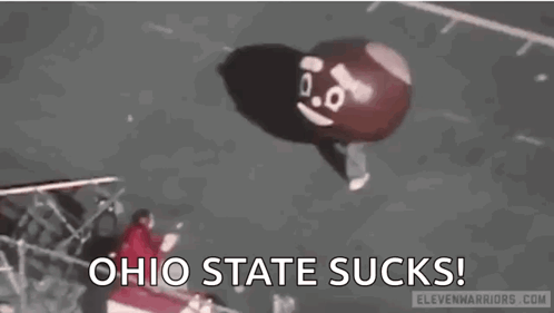 A Balloon With A Face On It Is Flying In The Air And Says `` Ohio State Sucks '' . GIF