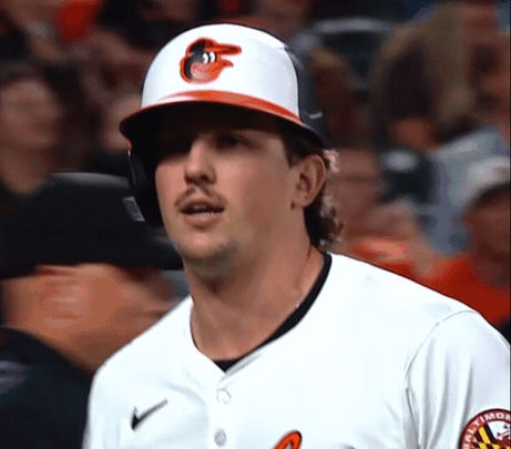 A Baltimore Orioles Baseball Player Wearing A Helmet And A White Jersey GIF