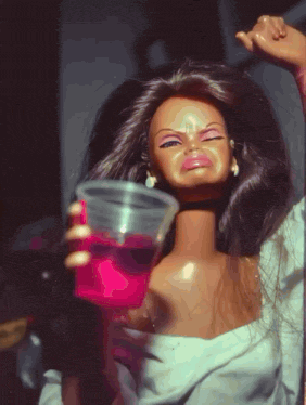 A Barbie Doll Is Holding A Pink Cup And Making A Funny Face GIF