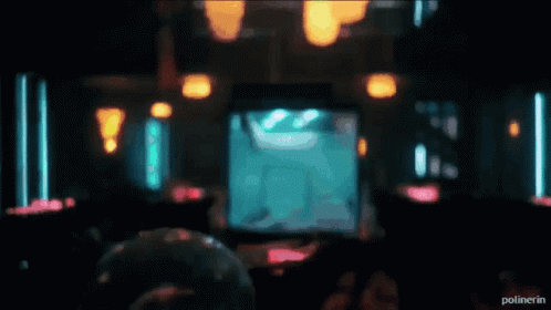 A Bartender Is Pouring A Drink Into A Glass With The Word Polinerin On The Bottom Right GIF