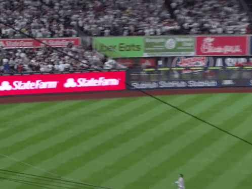 a baseball field with a sign that says statefarm on it