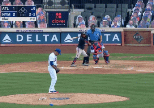 A Baseball Game Being Played In Front Of A Delta Ad GIF