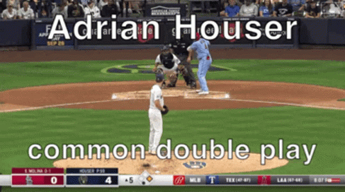 A Baseball Game Is Being Played And Adrian Houser Is Pitching The Ball GIF