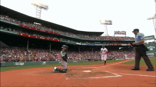 A Baseball Game Is Being Played At A Stadium That Has A Cvs Ad On The Wall GIF