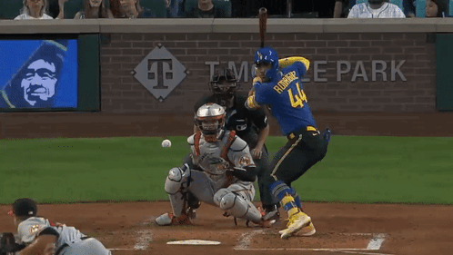 A Baseball Game Is Being Played At Temple Park And The Batter Is Wearing A Blue Jersey GIF