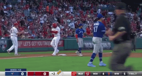 A Baseball Game Is Being Played Between The Angels And The Blue Jays GIF