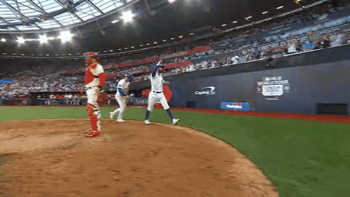 A Baseball Game Is Being Played In A Stadium With A Capital One Sign On The Wall GIF