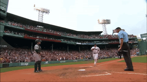 A Baseball Game Is Being Played In A Stadium With A Dell Ad On The Wall GIF