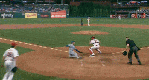 A Baseball Game Is Being Played In A Stadium With A State Farm Ad GIF