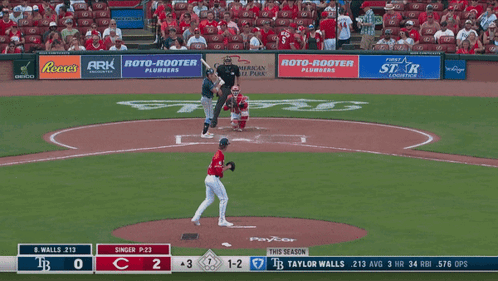 A Baseball Game Is Being Played In A Stadium With Advertisements For Reese 'S And Roto-Rooter GIF