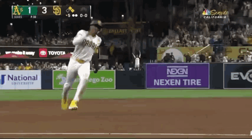 A Baseball Game Is Being Played In California With A Nexen Tire Ad In The Outfield GIF