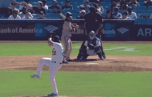 A Baseball Game Is Being Played In Front Of A Bank Of America Sign GIF
