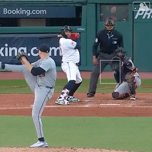 A Baseball Game Is Being Played In Front Of A Banner That Says Booking.com GIF