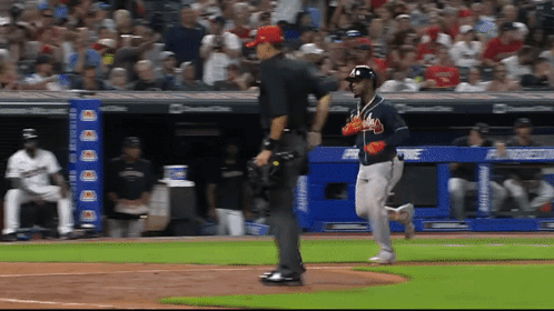 A Baseball Game Is Being Played In Front Of A Banner That Says Chase Bank GIF
