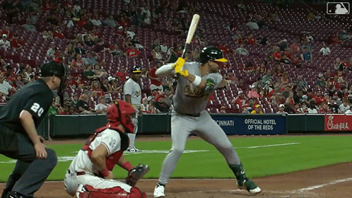 A Baseball Game Is Being Played In Front Of A Chick-Fil-A Banner GIF