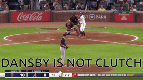 A Baseball Game Is Being Played In Front Of A Coca-Cola Ad GIF